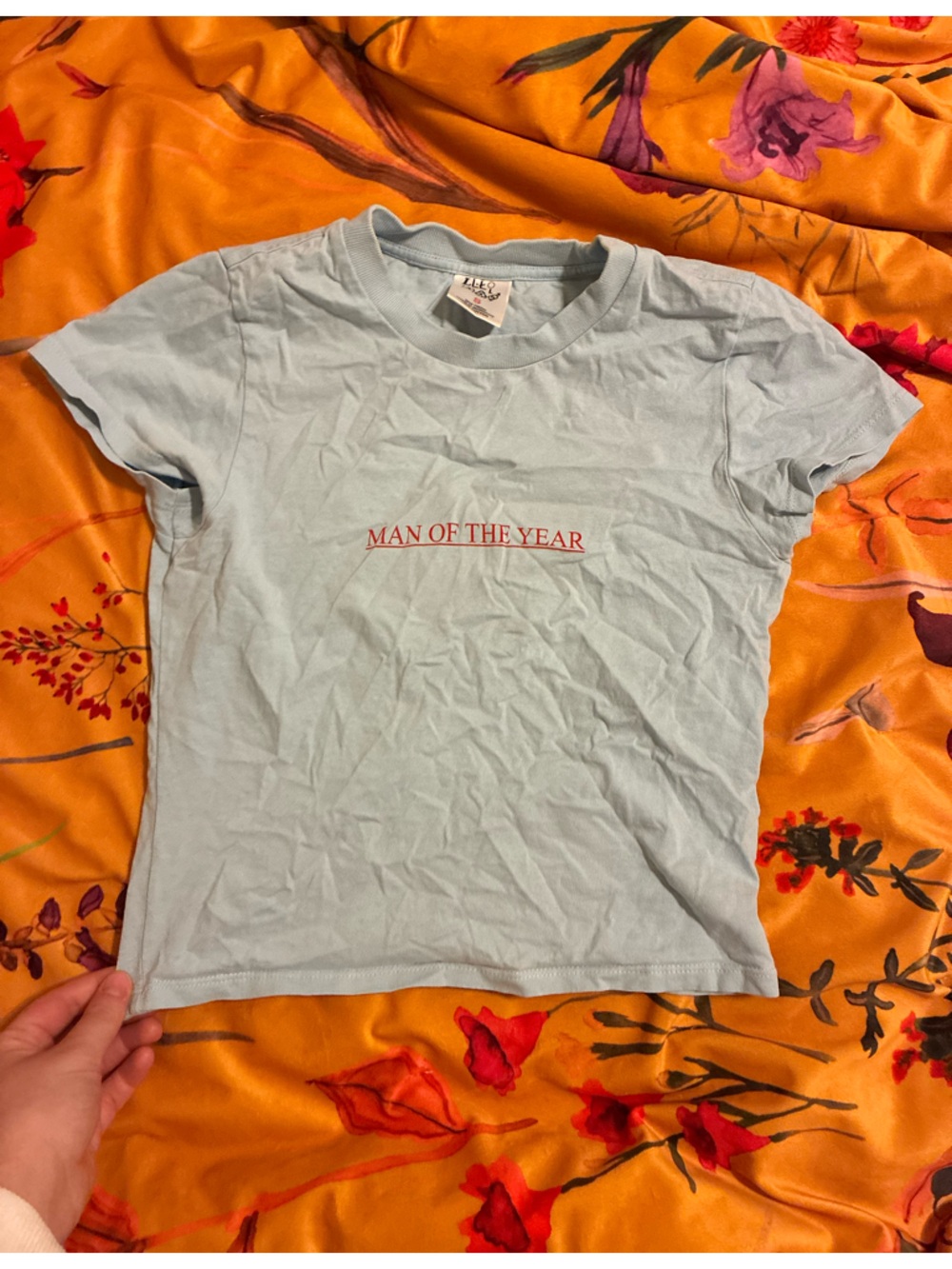 LORDE Merch: Light Blue "Man of the Year" Graphic Tee
